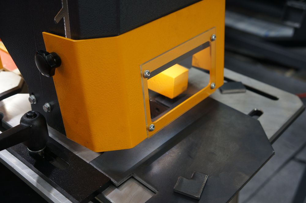 Cover,Safety,Guard,In,The,Metal,Machine,In,Industry,Plant. Yellow safety guard unit on industrial machinery.