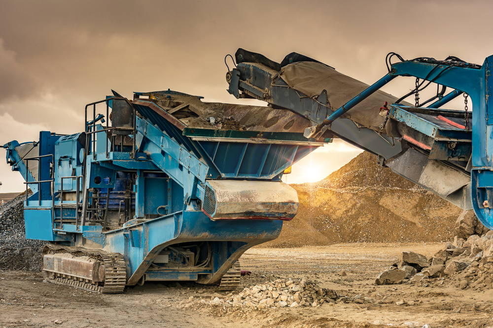 Mechanical,Conveyor,Belt Heavy industrial rock crushing machinery operating at a quarry.
