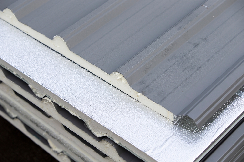 Corrugated,Sheet,Metal,Roofing,,Close-up,Of,Photo Stack of insulated metal roofing sandwich panels showing foam core.